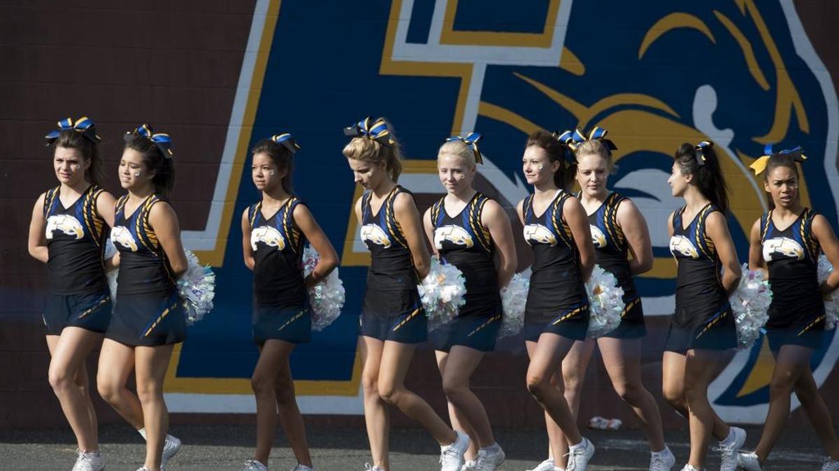 Cheerleaders rally before a Ferndale High School football game in 2015.