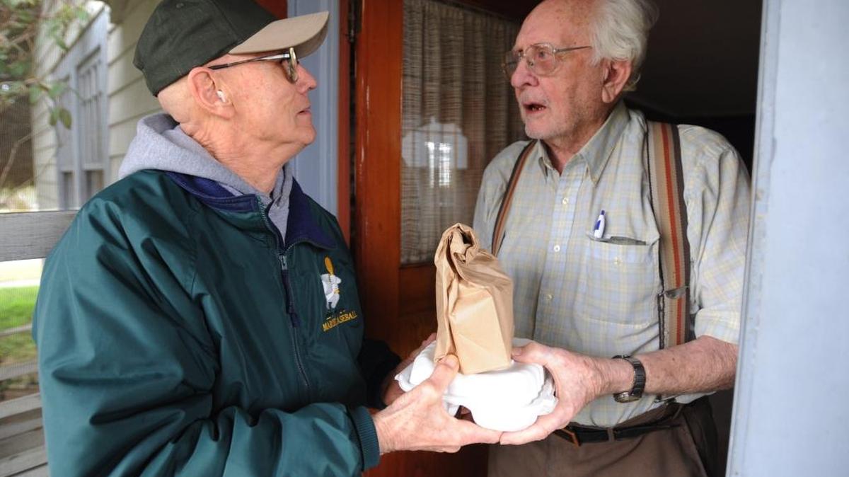 Meals on Wheels volunteer delivers a hot meal in Bellingham in 2009.