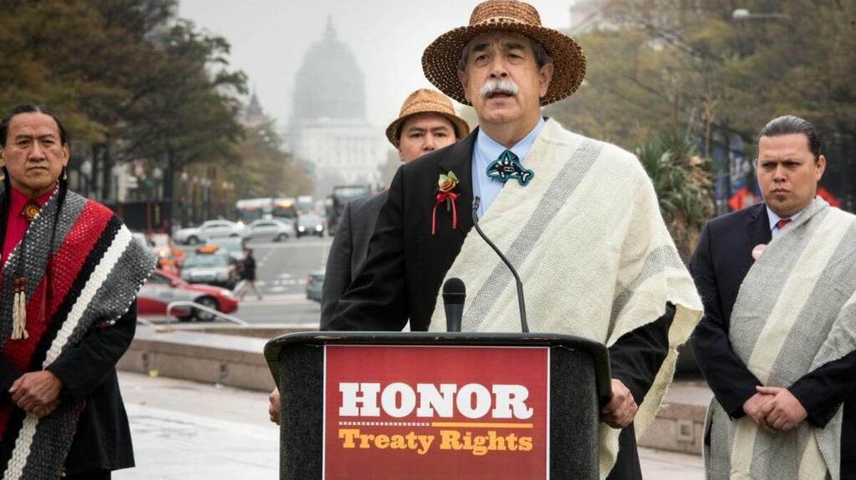 Mel Sheldon, chairman of Tulalip tribes speaks as he and other tribal leaders gather at a rally during the White House Tribal Nations Conference to urge Congress to uphold treaty rights and reject permits for a shipping terminal in Lummi's fishing waters at Freedom Plaza in Washington D.C., Nov. 5. As Lummi Nation fights to protect its fishing areas from North America's largest coal terminal, other tribes have faced their own development pressures and stand united with Lummi against the terminal and the erosion of treaty rights. Sen. Steve Daines, R-Montana, has led efforts in Congress to prevent the U.S. Army Corps from reviewing the impact of the terminal on the Lummi Nation’s treaty fishing rights — a central tenet of its trust responsibility.