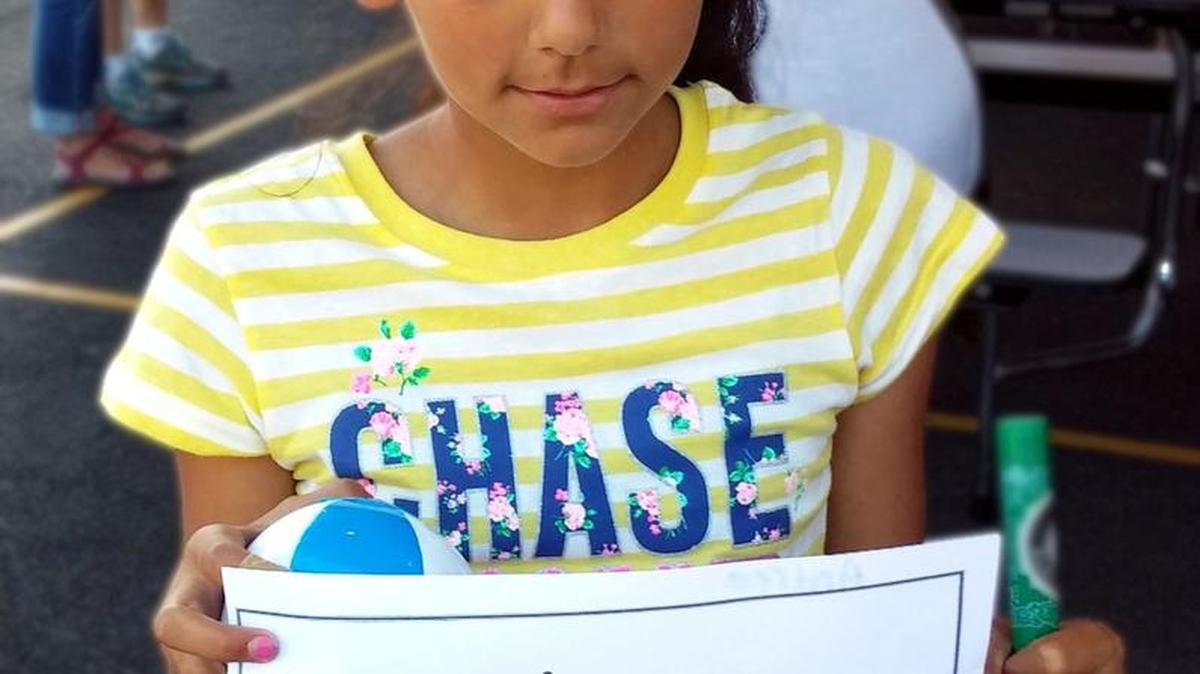 Participant offers a comment at the Whatcom Dispute Resolution Center’s Youth Program booth at a community outreach event at Birchwood Elementary School.