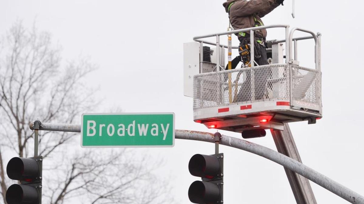 Floyd Elgin of Northwest Edison installs a new LED street light at the intersection of Broadway and Dupont streets in Bellingham, in December, 2015. Bellingham is changing out 3,600 streetlights from the current sodium lights to brighter, energy-saving LEDs.