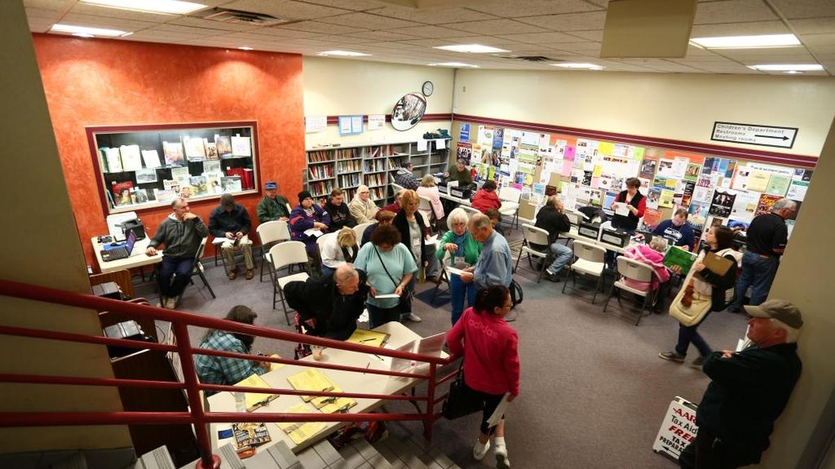Volunteers provide tax preparation assistance at the Bellingham Public Library. More than 1,600 people visited the Central Library in 2015 seeking help preparing their federal income tax returns, a service provided free of charge by the Tax-Aide Program of the AARP Foundation.