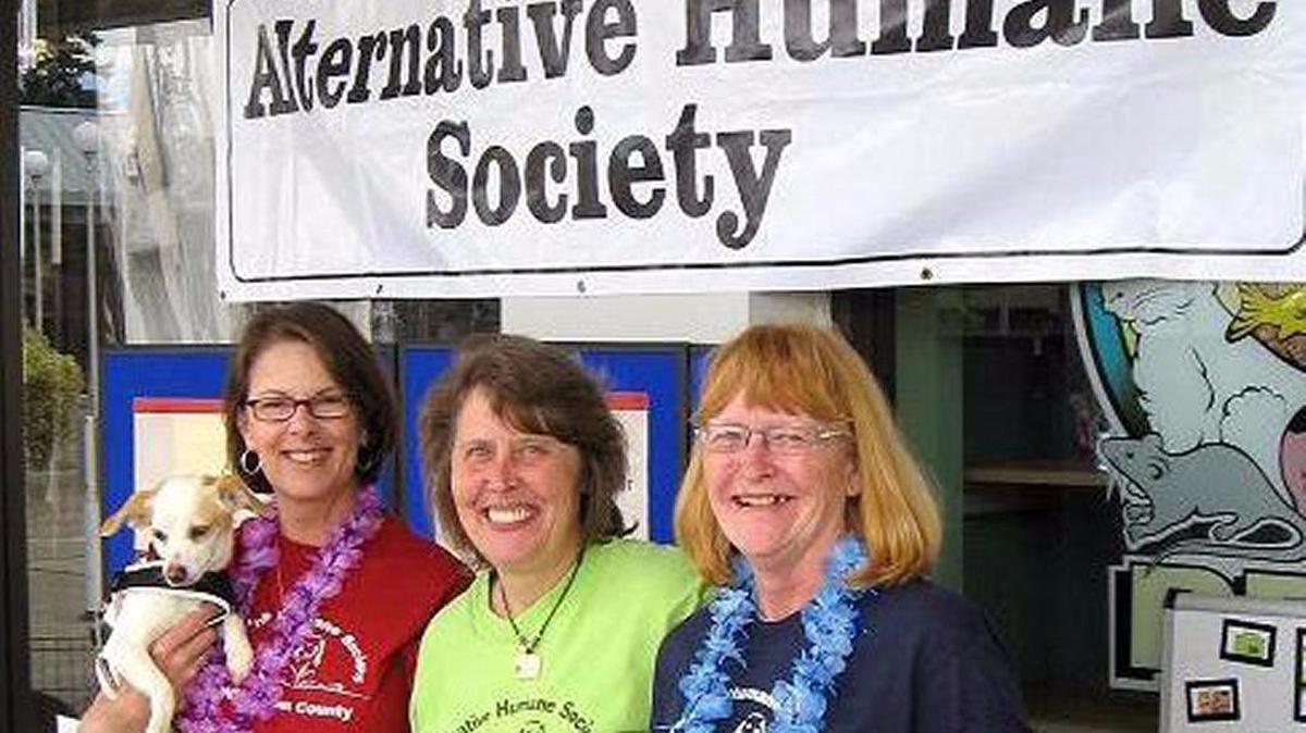 Volunteers at the Paws and Claws booth at Bloedel Donovan Park in July, 2014.
