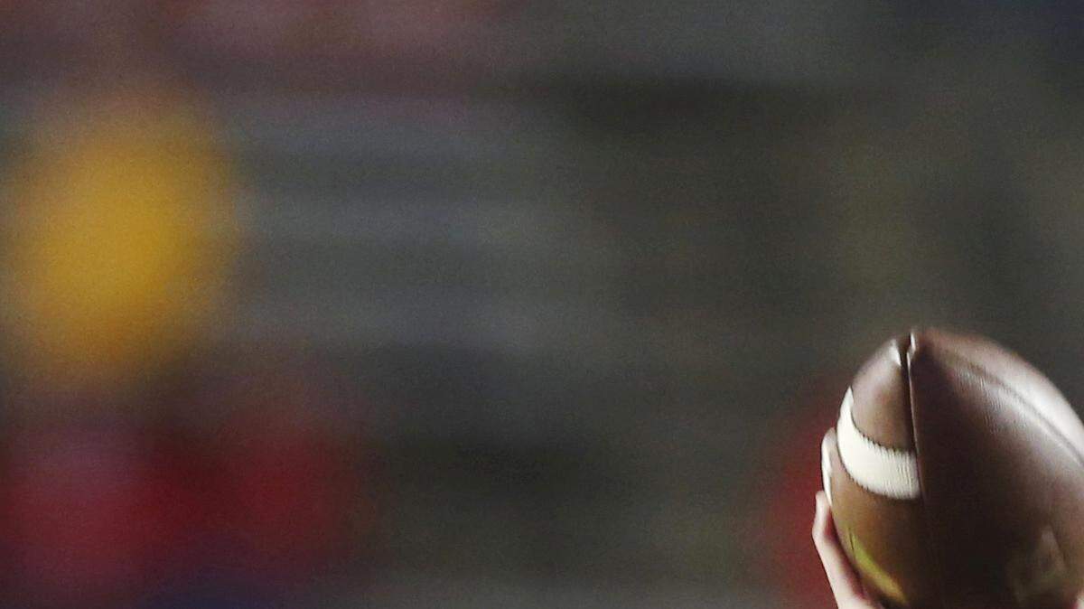FILE - In this Oct. 24, 2015 file photo, Rutgers quarterback Chris Laviano warms up before a game against Ohio State in Piscataway, N.J. Rutgers first-year coach Chris Ash said Laviano will be the starting quarterback in the season opener at Washington.
