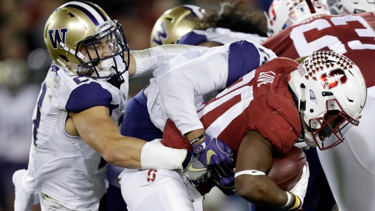 Stanford running back Bryce Love, right, is tackled by Washington defensive back Taylor Rapp Nov. 10 in Stanford, California. Rapp, a alum of Sehome High School, has been selectet first-team All-Pac-12.