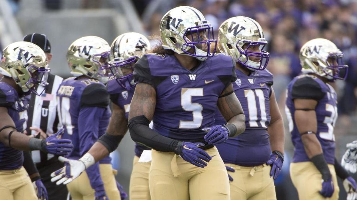 
Washington defensive lineman Joe Mathis lines up during the Huskies’ win over Utah State on Saturday, Sept. 19, 2015. The Washington defense will be tested this week against California’s high-powered offense.

