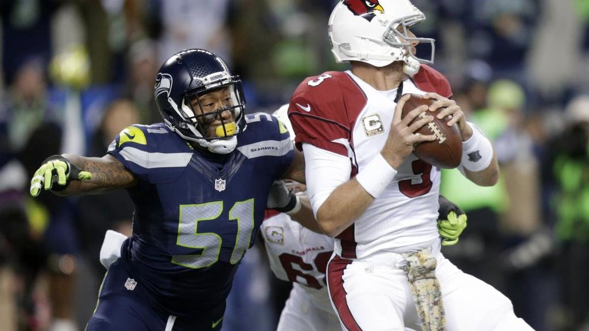 Seahawks outside linebacker Bruce Irvin (51) pressures Cardinals quarterback Carson Palmer during a game Nov. 15. Irvin is an unrestricted free agent, and will likely be offered more money from other teams than the Seahawks would be willing to pay.