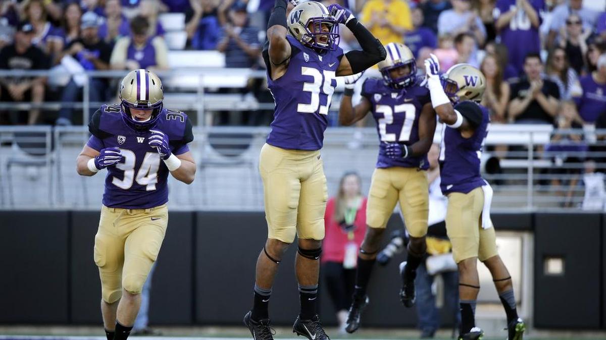 
Washington’s Brian Clay (35), a candidate to start at strong safety for the Huskies, missed a few practices recently to work on his master’s degree.
