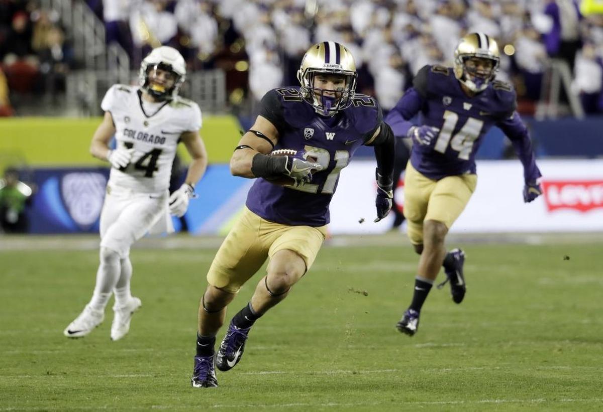 University of Washington defensive back Taylor Rapp cuts upfield after intercepting a Colorado pass during the second half of the 2016 Pac-12 Conference championship game. Rapp, a graduate of Sehome High School, announced he will leave UW and enter the NFL Draft.