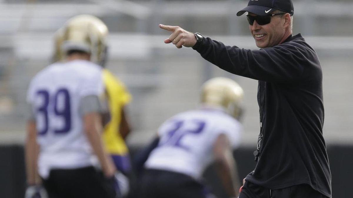 
University of Washington coach Chris Petersen, right, returns to Boise on Friday where he won 92 games as coach of the Boise State Broncos from 2006-13. The Huskies and Broncos play at 7:15 p.m. Friday.
