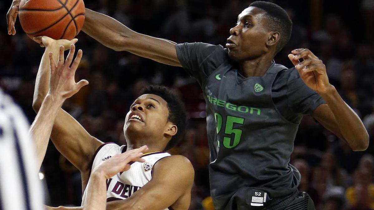 Oregon senior forward Chris Boucher, right, a junior-college transfer, scores 12.6 points per game and leads the Pac-12 in blocked shots with an average of 3.3.