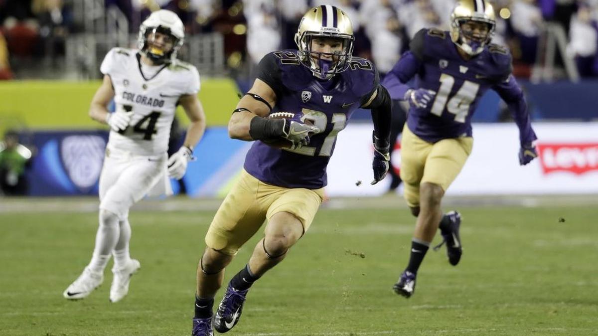 Washington defensive back Taylor Rapp runs after intercepting a Colorado pass during the second half of the Pac-12 Conference championship Dec. 2 in Santa Clara, Calif.