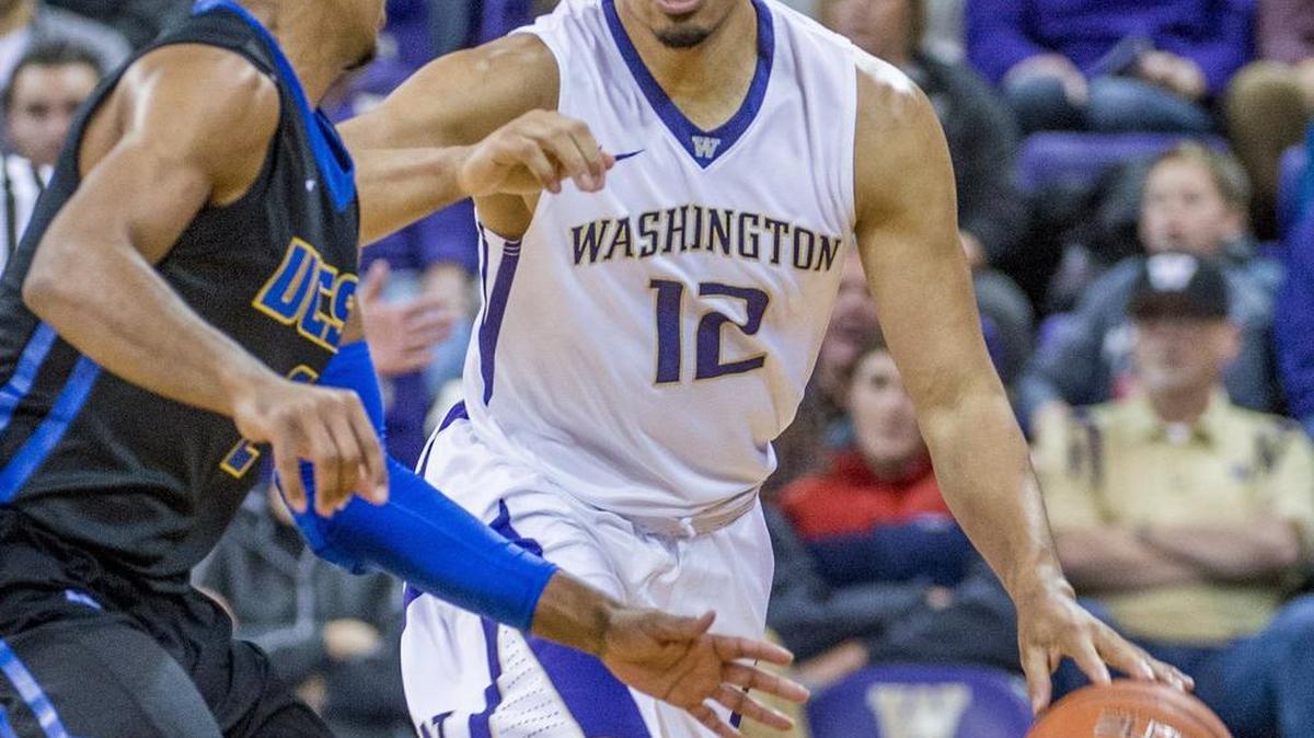 Washington’s Andrew Andrews (12) dribbles against UC Santa Barbara on Dec. 28. Andrews has thrived in his new role as point guard — a position he has not played since high school.