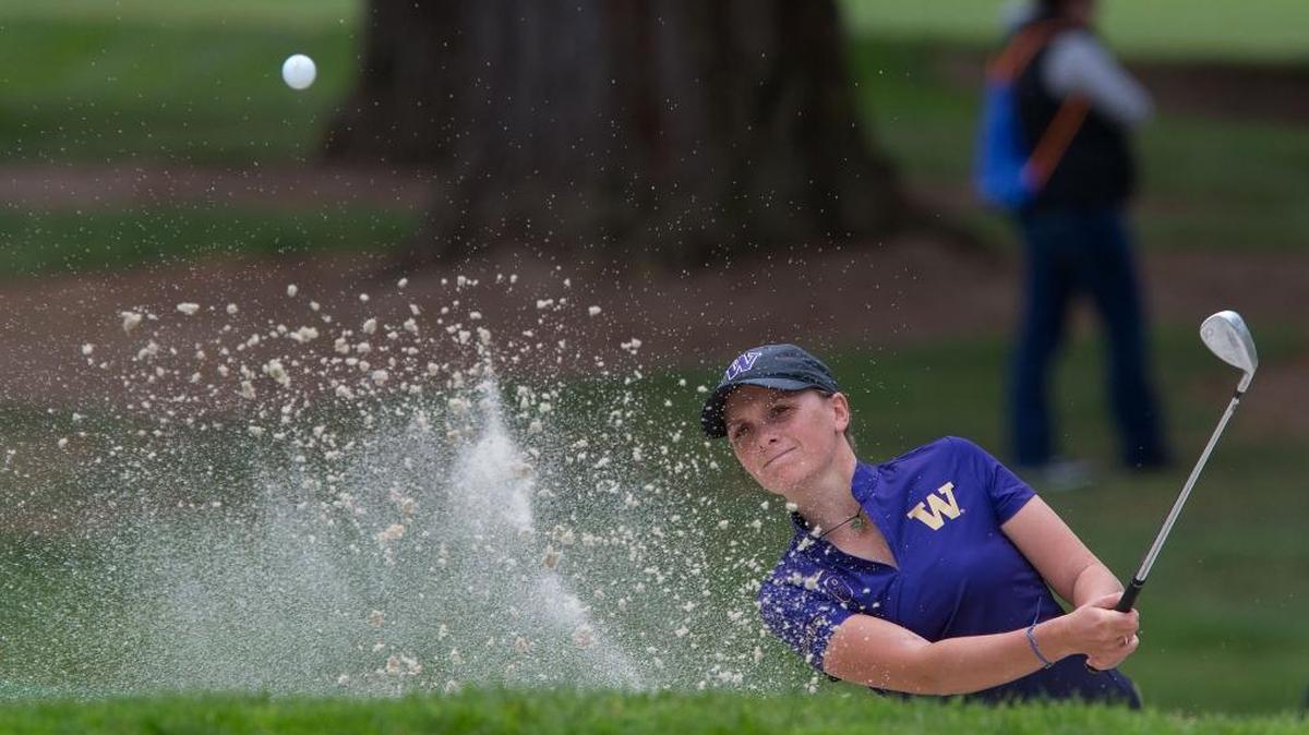 Washington's Charlotte Thomas blasts out of a bunker on the 1st hole during the final round of the NCAA Division I women's golf championships at Eugene Country Club in Eugene, Ore. Wednesday, May 25, 2016.