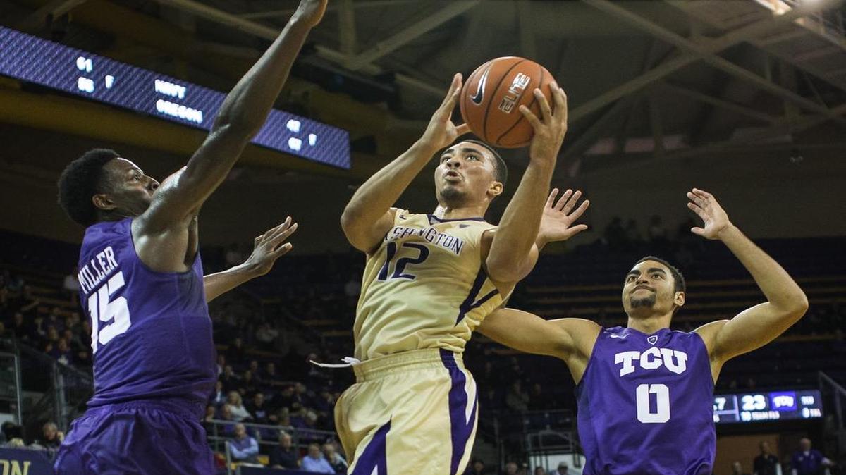 Washington’s Andrew Andrews (12) goes up for a basket against TCU on Tuesday night. Andrews scored a game-high 32 points and was 6 for 6 from 3-point range.