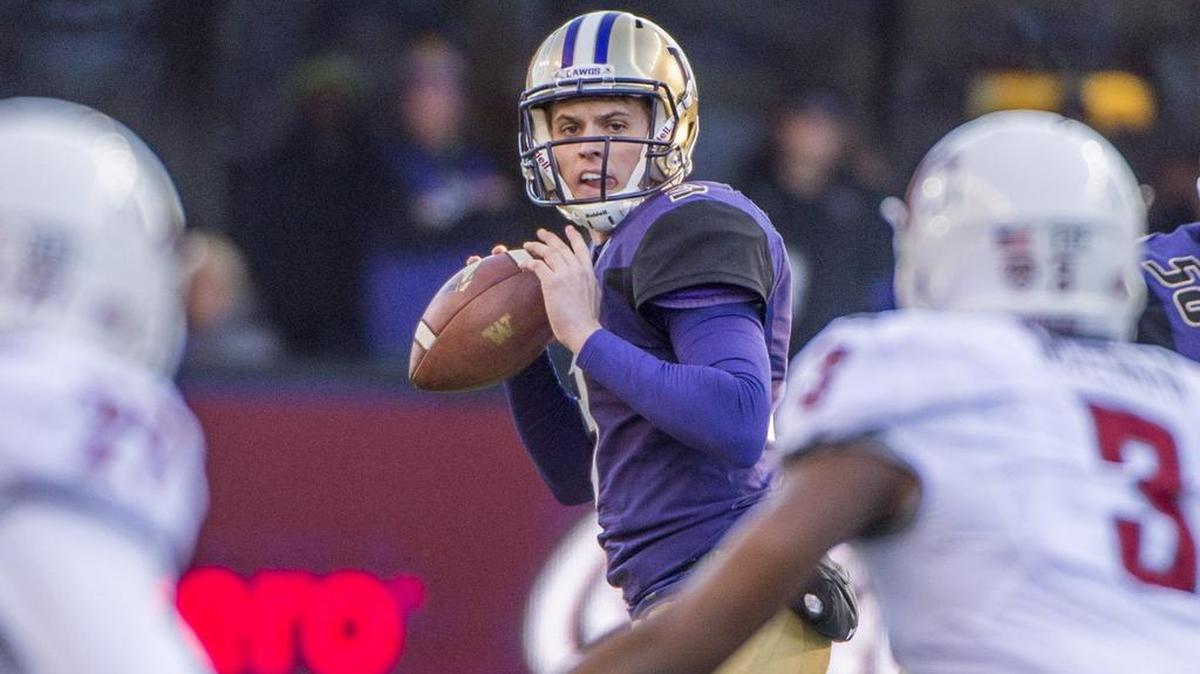 Washington's Jake Browning looks to throw in the Apple Cup football game in Husky Stadium, November 27, 2015. UW Huskies beat the WSU Cougars 45-10.