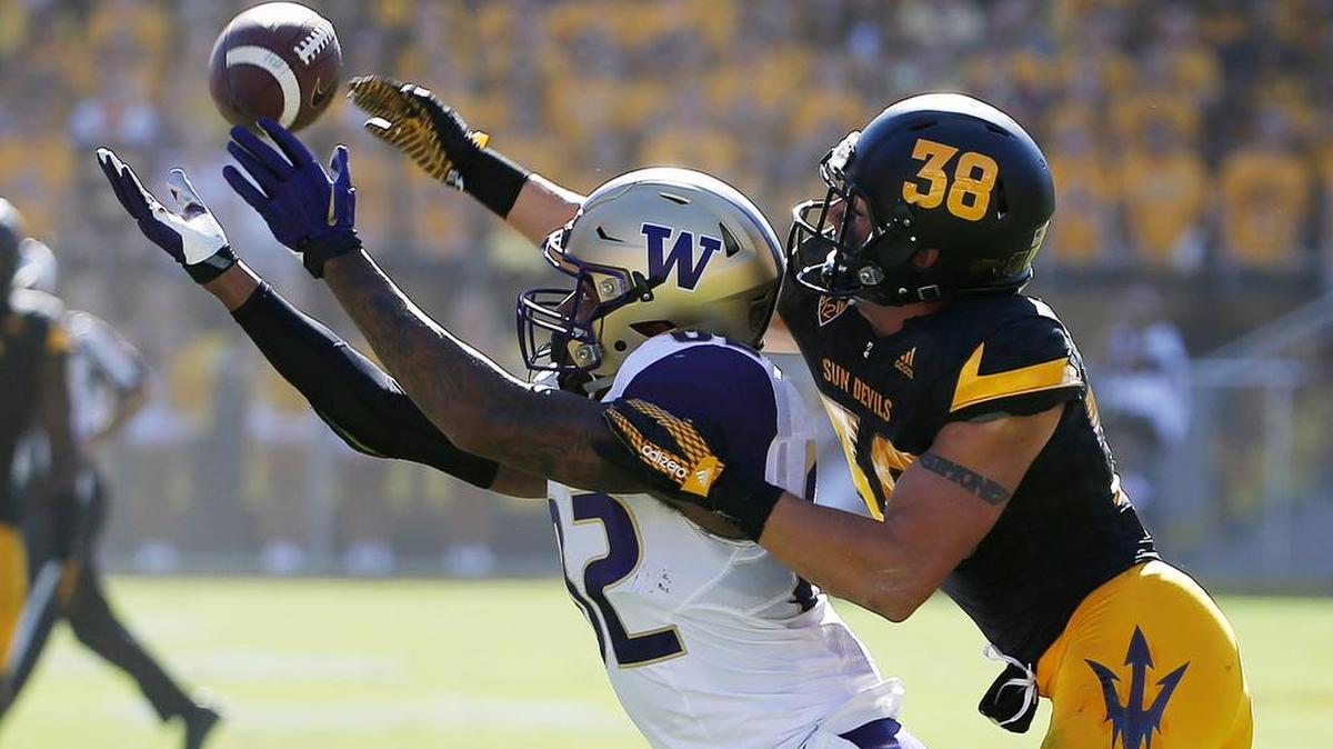 Arizona State's Jordan Simone (38) tips a pass away from Washington's Joshua Perkins, left, during the first half of an NCAA college football game Saturday, Nov. 14, 2015, in Tempe, Ariz.