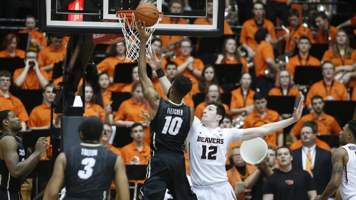 Colorado’s Tre’Shaun Fletcher (10) shoots over Oregon State's Drew Eubanks (12) in a game Feb. 6. Fletcher also played high school basketball for Lincoln.