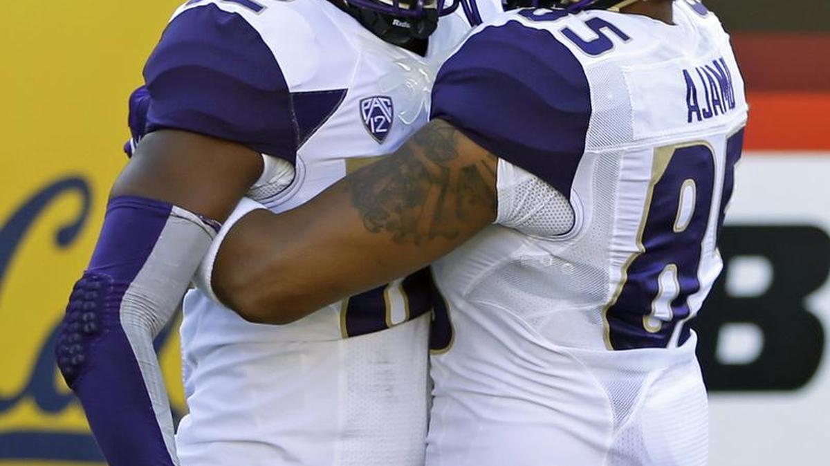 The Huskies lost tight end David Ajamu Washington's Joshua Perkins (82) celebrates with teammate David Ajamu (85) after scoring a touchdown against California during the first half of an NCAA college football game Saturday, Oct. 11, 2014, in Berkeley, Calif. (AP Photo/Ben Margot)