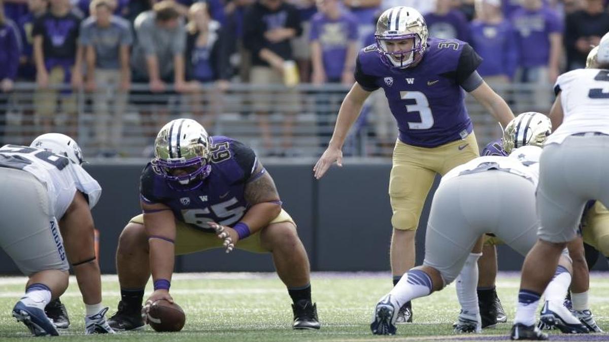 
Washington quarterback Jake Browning (3) on the line of scrimmage against Utah State in the second half of an NCAA college football game, Saturday, Sept. 19, 2015, in Seattle. Washington beat Utah State 31-17.
