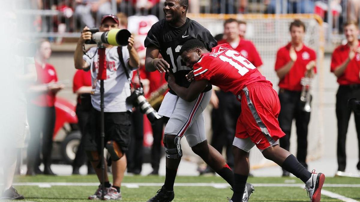 Ohio State quarterback Cardale Jones (12) and J.T. Barrett (16) at half time of the Buckeyes' Spring Football Game on Saturday, April 18, 2015, in Columbus, Ohio. 