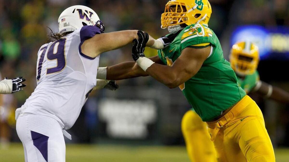 
Coleman Shelton, left, has started at three of the five positions on the offensive line for the Washington Huskies.

