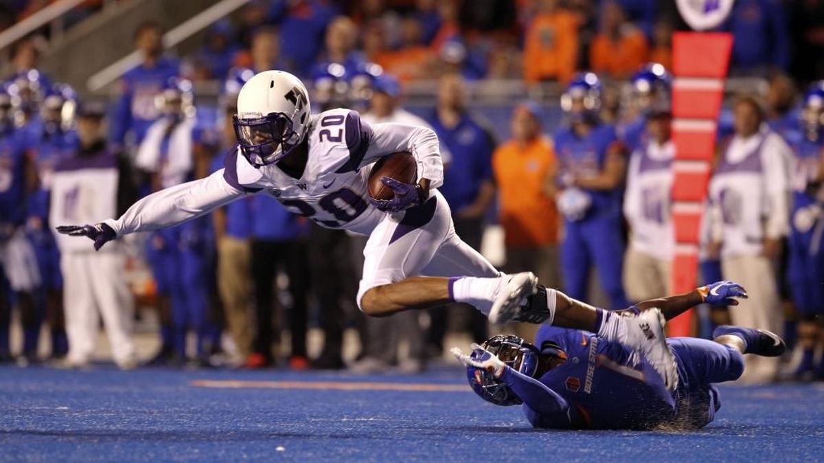 
University of Washington defensive back Kevin King (20) gets tackled by Shane Williams-Rhodes after intercepting a pass in the season-opener at Boise State.
