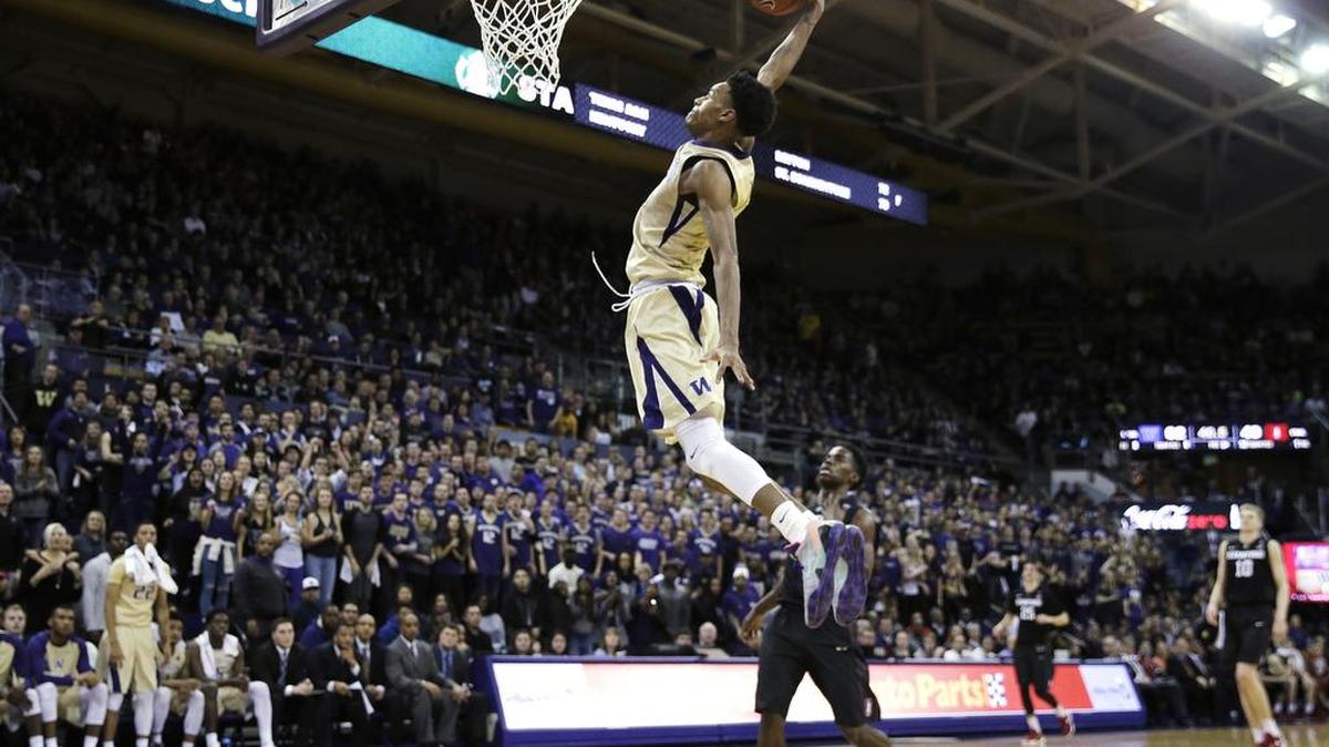 Washington guard Dejounte Murray is all alone for a dunk against Stanford during the second half of an NCAA college basketball game Saturday, Feb. 20, 2016, in Seattle. Murray had 25 points to lead Washington to a 64-53 win over Stanford.