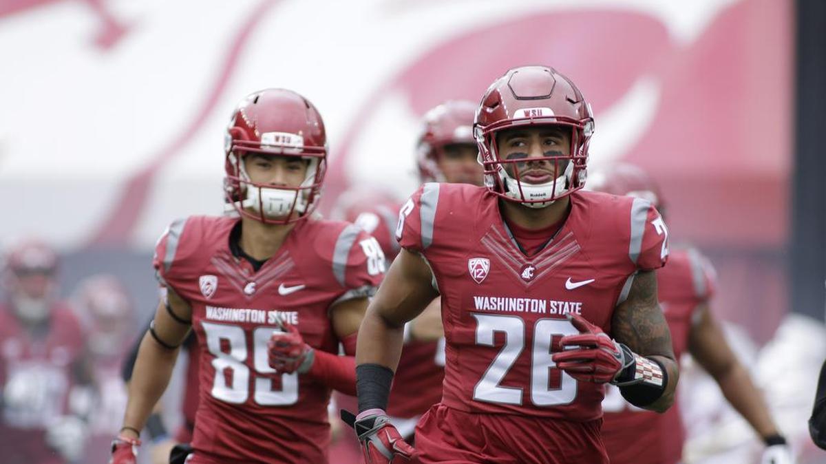 Washington State safety Hunter Dale (26) and his teammates run onto the field before an NCAA college football game against Idaho in Pullman, Wash., on Sept. 17, 2016.