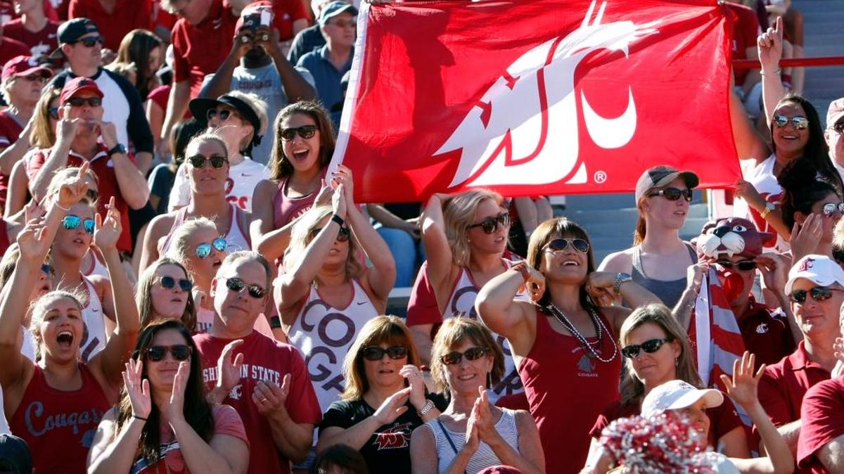 Washington State fans celebrate against Arizona during the first half of an NCAA college football game, Saturday, Oct. 24, 2015, in Tucson, Ariz.