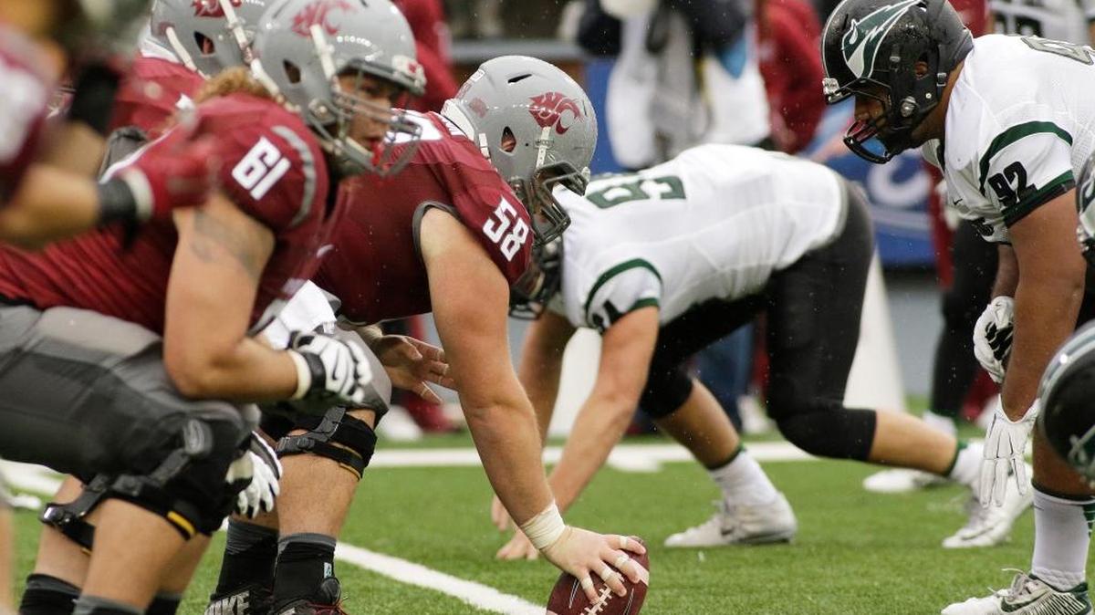 Washington State offensive lineman Riley Sorenson (58) prepares to hike the ball against Portland State during the second half of an NCAA college football game, Saturday, Sept. 5, 2015, in Pullman, Wash.