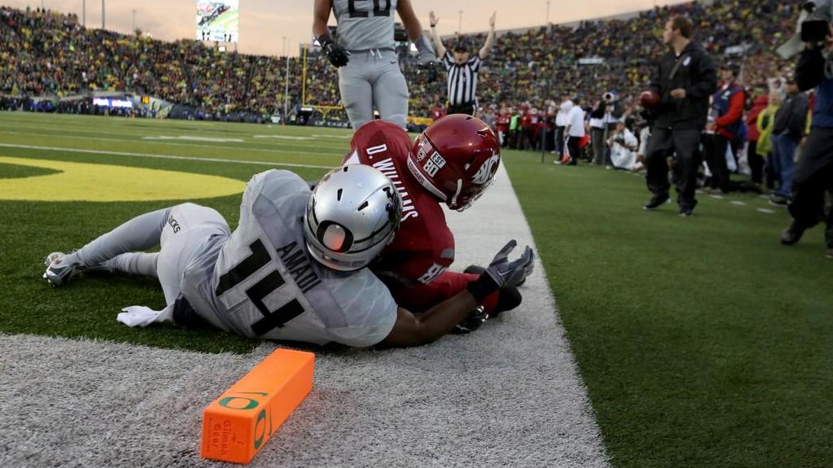
Washington State wide receiver Dom Williams (80) catches the football for a touchdown during the second half Saturday against Oregon. The Ducks, who visit Washington on Saturday, rank 93rd nationally in yards per play allowed, and 116th in scoring defense (38.7 points per game). Meanwhile, the Cougars play host to Oregon State on Saturday.
