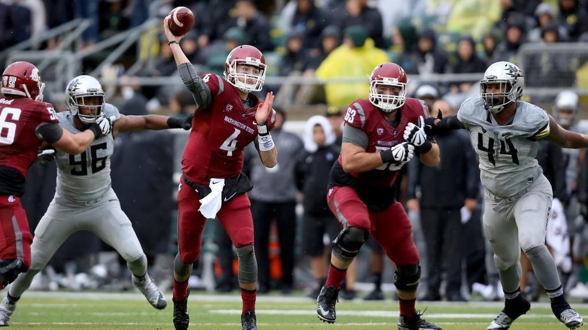 
Quarterback Luke Falk (4) led Washington State to a game-tying touchdown Saturday in the final two minutes at Oregon. The Cougars won 45-38 in double overtime.
