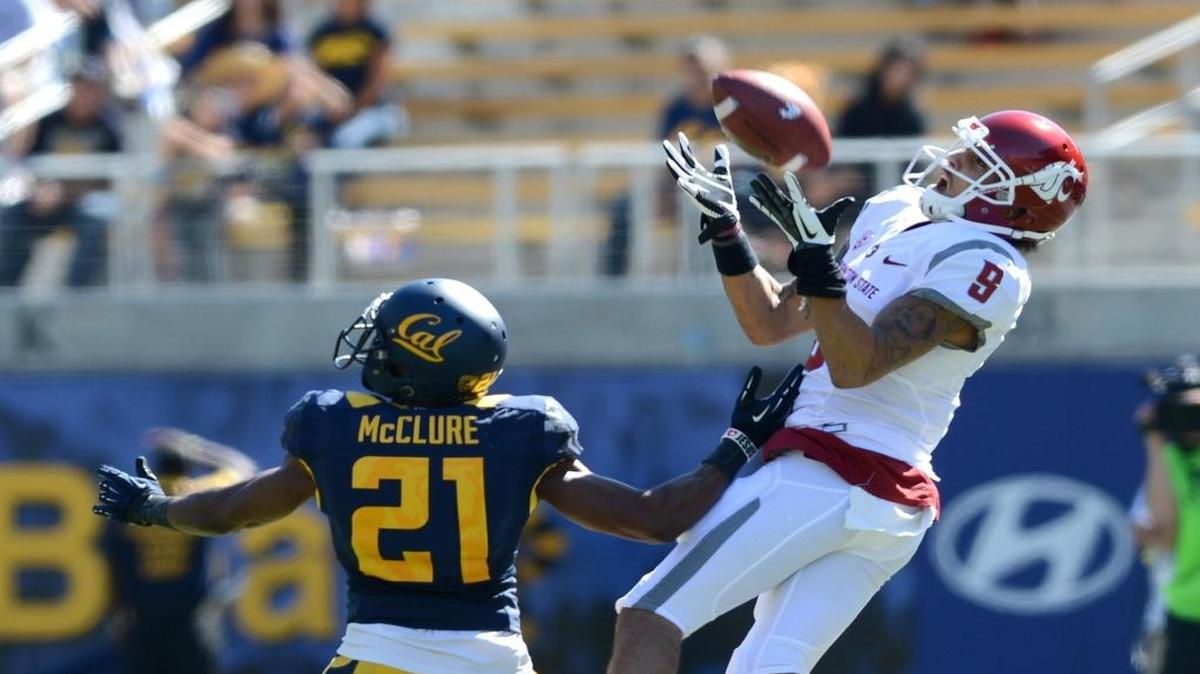 
Washington State’s Gabe Marks (9) makes a tough catch in the first half against Cal’s Stefan McClure (21) at Memorial Stadium in Berkeley, California, on Oct. 5, 2013. 
