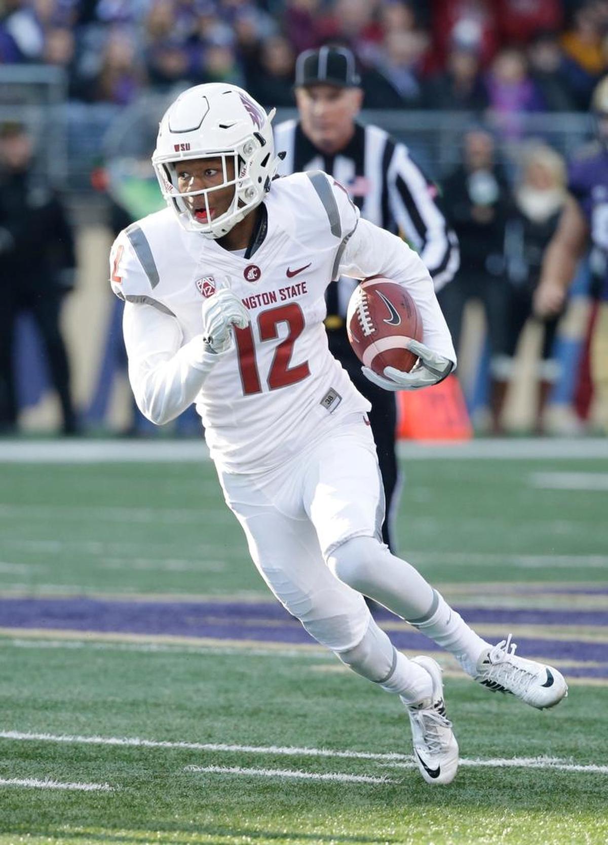 Washington State’s Tavares Martin Jr. run upfield in a game against Washington Nov. 27, 2015, in Seattle.