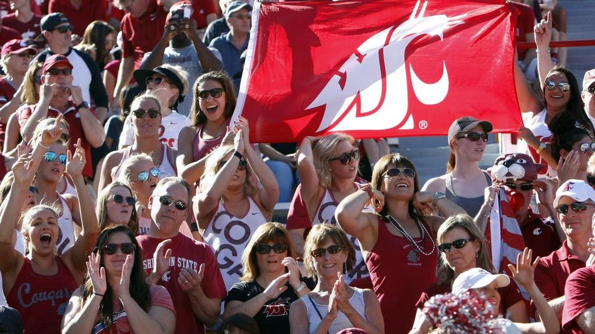 Washington State fans celebrate against Arizona during the first half of an NCAA college football game, Saturday, Oct. 24, 2015, in Tucson, Ariz.
