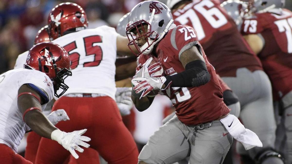 Washington State running back Jamal Morrow (25) runs with the ball Sunday against Eastern Washington. Morrow has been the Cougars lone captain dating to last season.