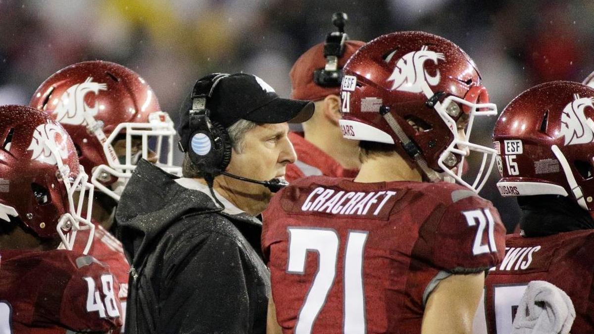 Washington State head coach Mike Leach speaks to his team during a timeout during the first half of an NCAA college football game against Stanford, Saturday, Oct. 31, 2015, in Pullman, Wash.