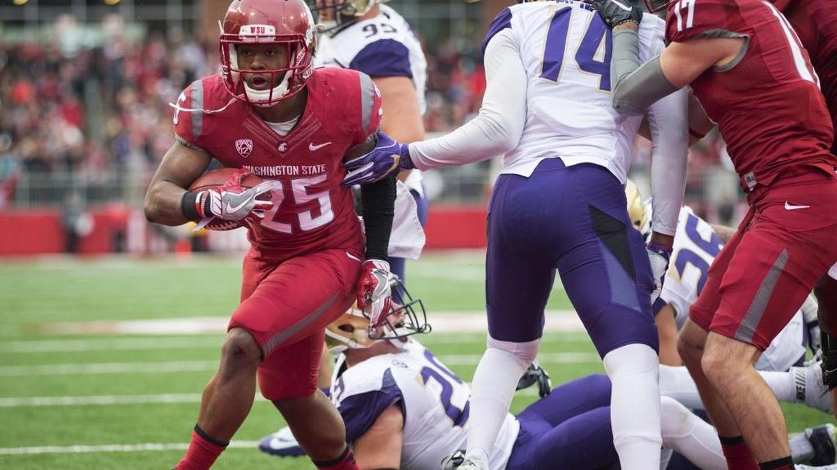 Washington State running back Jamal Morrow runs for a 1-yard touchdown in the second quarter against Washington in the 109th Apple Cup at Martin Stadium in Pullman, Wash., on Friday, Nov. 25, 2016.