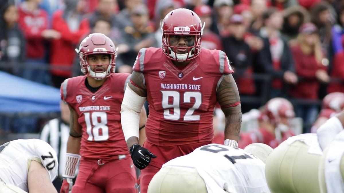 Washington State nose tackle Robert Barber (92) and safety Shalom Luani (18) prepare for a play during the second half of an NCAA college football game against Idaho in Pullman, Wash., Saturday, Sept. 17, 2016.
