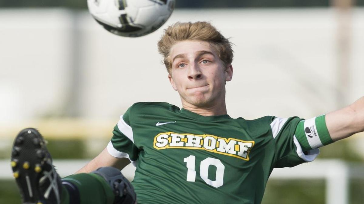Sehome’s Mason Rathkamp kicks the ball in the air during a 2016 Class 2A state semifinal in Sumner. Rathkamp has signed to play soccer for Western Washington University next fall.
