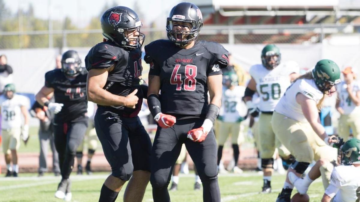 Central Washington defensive lineman Bo Banner (48) celebrates with a teammate. Banner, a Sehome High alum, was selected the GNAC Defensive Lineman of the Year.