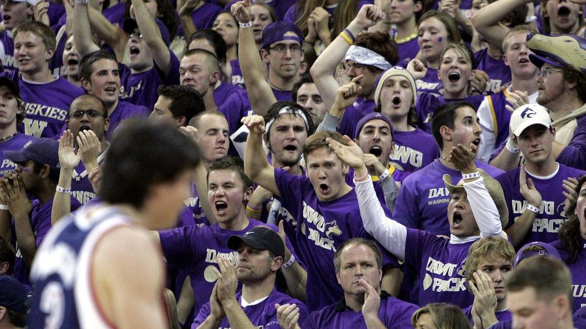 Washington fans cheer as Gonzaga’s Adam Morrison heads toward the bench for a timeout, Sunday, Dec. 4, 2005, in Seattle. The two schools will resume their home-and-home series next season in Spokane.