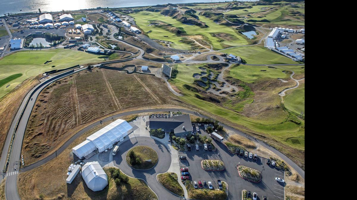 
The intensity of work is evident from the air and on the ground as the final touches are applied to the links-style golf course at Chambers Bay for the 2015 U.S. Open.
