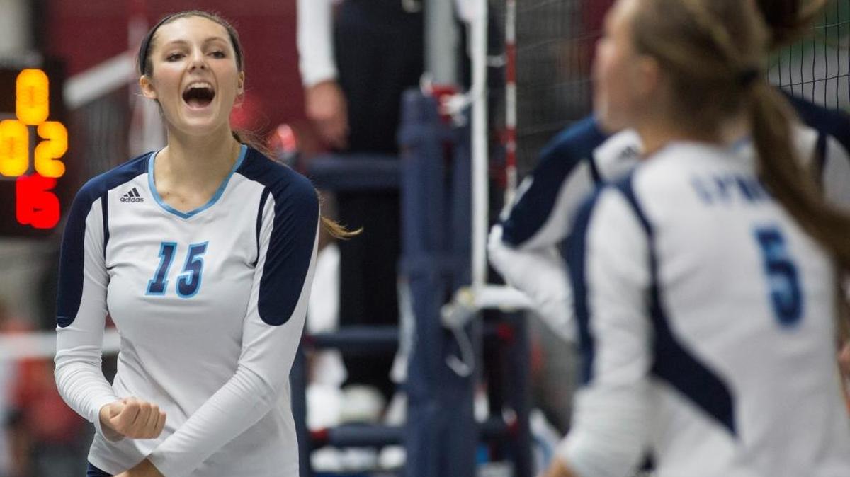 Lynden Christian’s Kara Bajema (15) celebrates with teammates after winning the first set against Montesano in the first round at the Class 1A State Volleyball Tournament on Friday, Nov. 13, at the Yakima Valley SunDome.