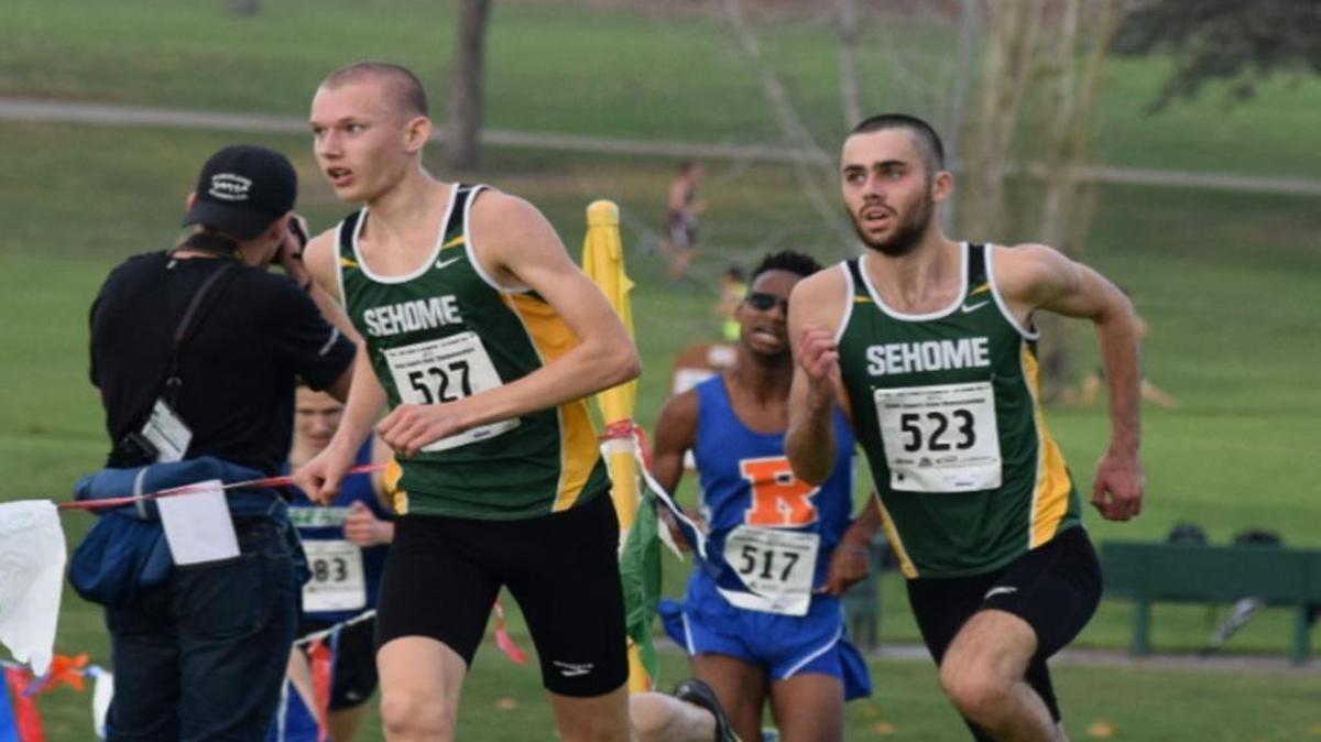 Sehome’s Colton Johnsen, left, and Riley Allsop race for the finish at the Class 2A State Cross Country Championships Saturday, Nov. 7, in Pasco. Johnsen finished second, while Allsop with third, helping the Mariners win a fourth-straight title.