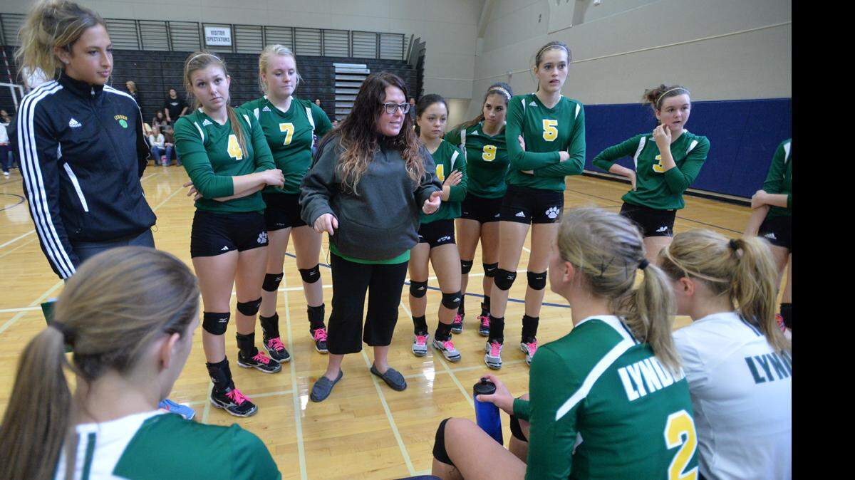 Lynden head coach Julie Clift, center, talks to her team between games as Lynden beat Lakewood in five games to advance to the state tournament at the the 2A Bi-District Volleyball Tournament on Nov. 9, 2013 in Bellingham.