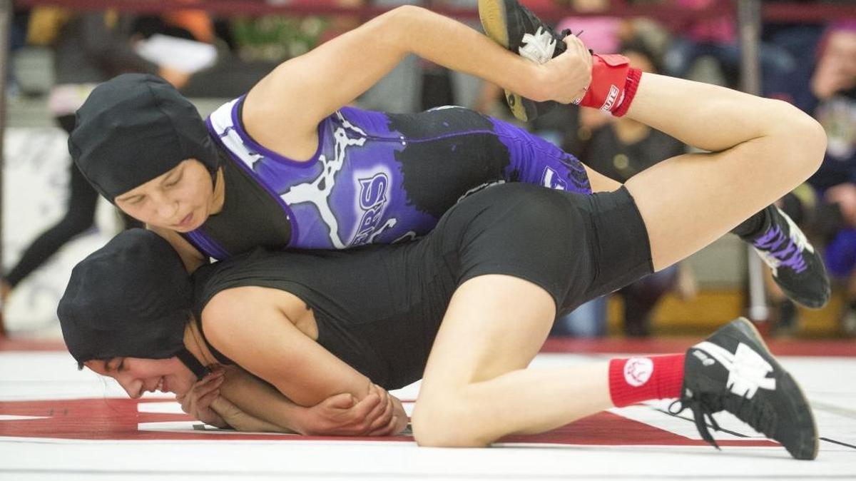 Nooksack Valley's Maria Cazares takes Mount Baker's Michelle Mata to the ground at the Girls' Regional Wrestling Tournament on Saturday, Feb. 14, at Bellingham High School.