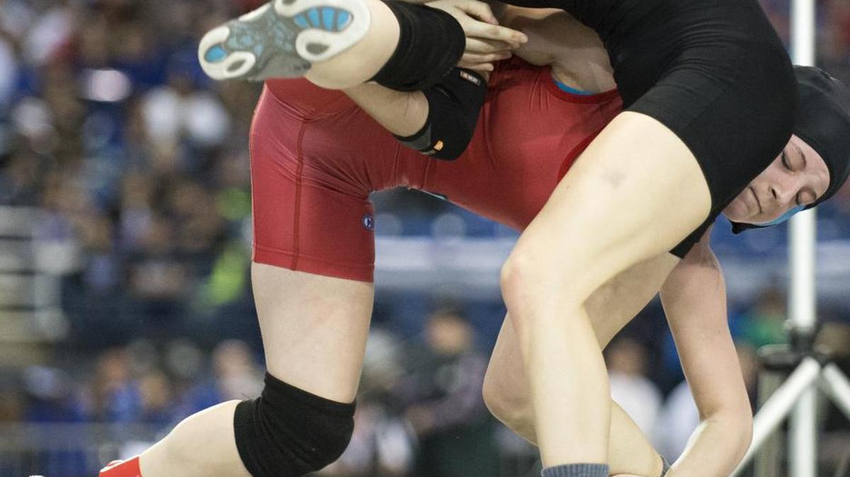 Mount Baker's Natalie Smith takes Eastmont's Morgan Jones to the ground in the girls' 125-pound championship match at Mat Classic XXVIII at the Tacoma Dome.