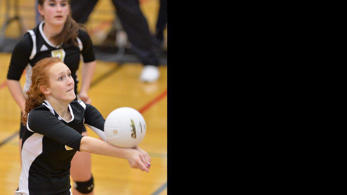 Meridian's Emma Weg bumps the ball as Lynden Christian beat Meridian in the first round of the 1A Northwest District Volleyball Tournament on Oct. 30, 2013 in Lynden.